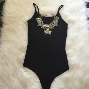 Ribbed body suit with open ladder back
