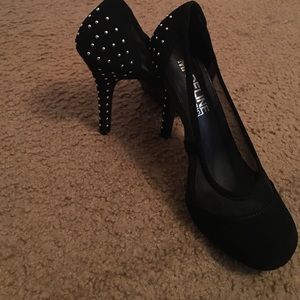 Black shoes with silver studs on the back