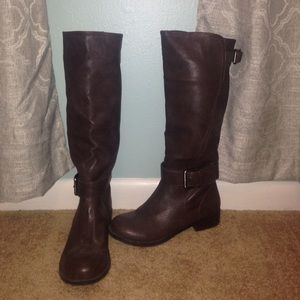 Brown riding boots.