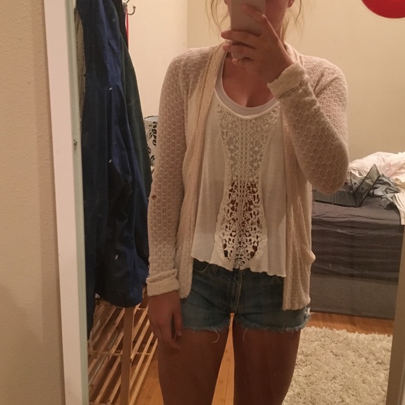 Cream colored, short cardigan. $5/OBO