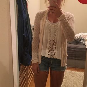 Cream colored, short cardigan. $5/OBO