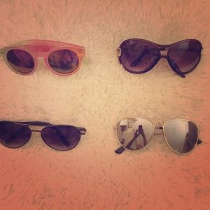 Lot of Sunglasses in Clinique Cosmetic Bag