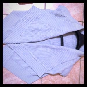 A gray short sleeve vest