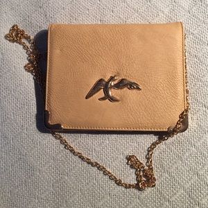 Nude and gold clutch