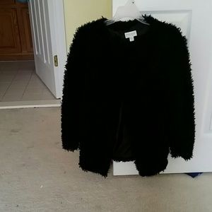 A furry  black  coat