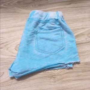 2 shorts one blue and other is white
