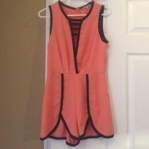 Coral with black trim romper