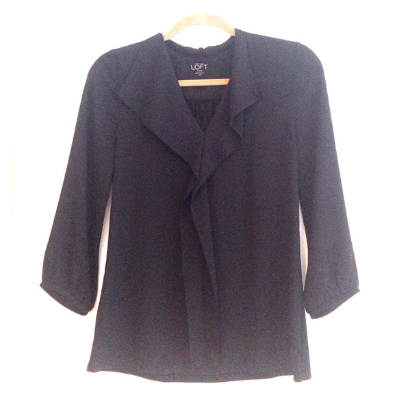 Black knit back polyester front v neck blouse.