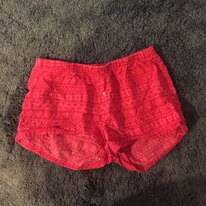 Red patterned shorts with sparkly buttons
