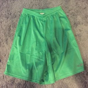 Green athletic shorts by champion. Never worn.
