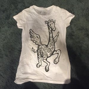 White shirt with a graphic of a giraffe with wings