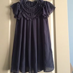 Flowy high neck top with back button detail