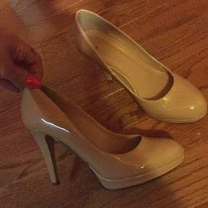 Nude patent pumps