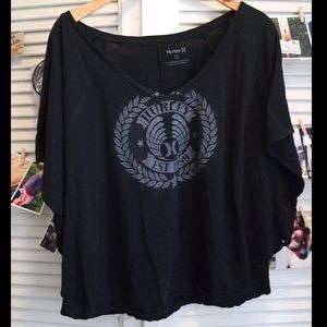 Hurley Flowy short top with short belle sleeves.