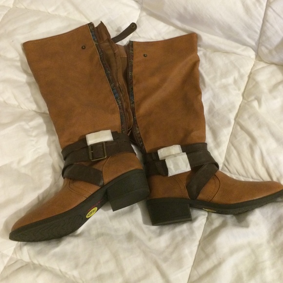 tan boots with print around the zipper