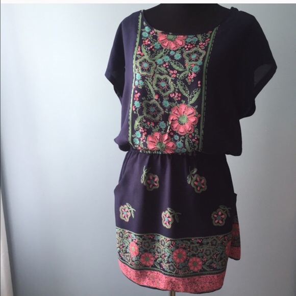 Dress with roll tab sleeves and pockets