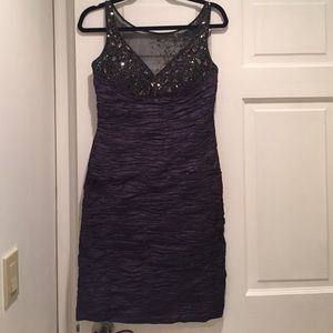Purple form fitting formal dress with rhinestone