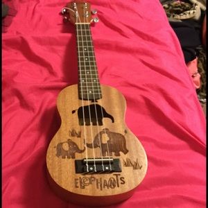 Ukulele with elephant engravings