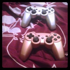 2  PlayStation 3 game controllers