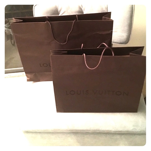 2 Louis Vuitton shopping bags.