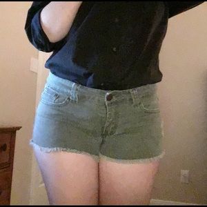 Green distressed shorts