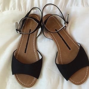 Black canvas cross ankle strap sandal .