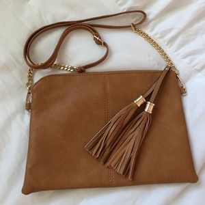 NEW Cross body tobacco colored purse with tassel.