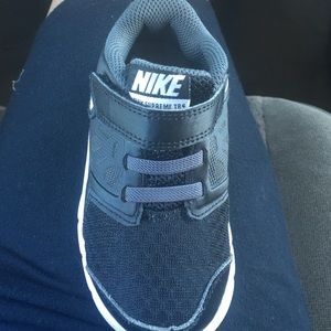 Toddler black nike shoes , they are unisex.