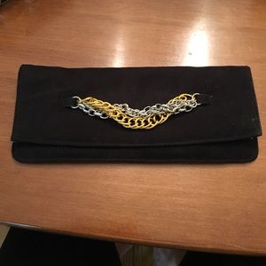 Black suede clutch with gold and silver hardware