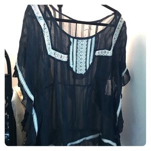 Dark green blouse with white detailing