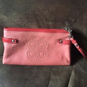 Coach medium sized wrist let in coral color