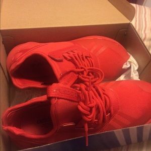 All red adidas .