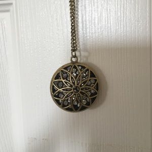 Long brass and jewel necklace