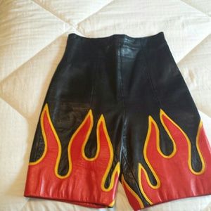 Black leather flame sorts, hits about miss thigh