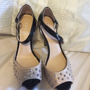 Studded cream and black strapped pumps