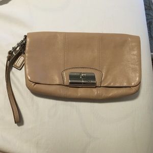 Tan leather Coach wristlet/small clutch