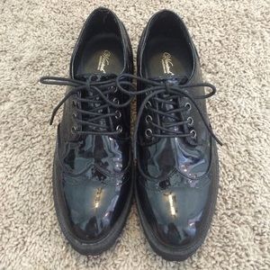 Shiny black loafers