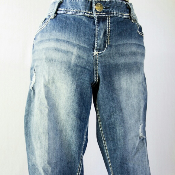 Washed and lightly stressed ankle rolled jeans