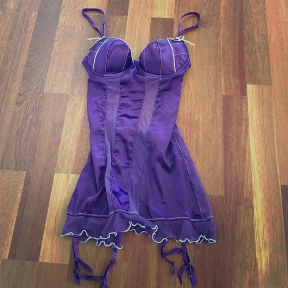 Purple one piece corset with garters.