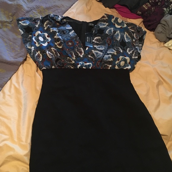 Bodycon dress with paisley flutter sleeve.