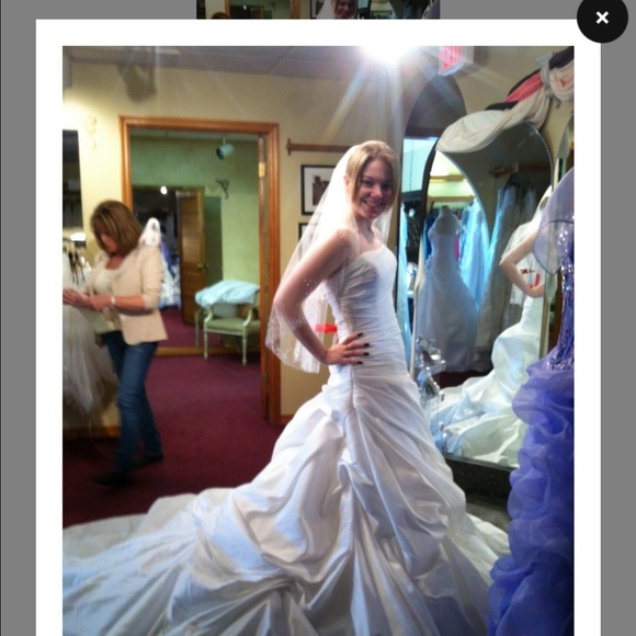 New, with original tags still on, wedding dress.