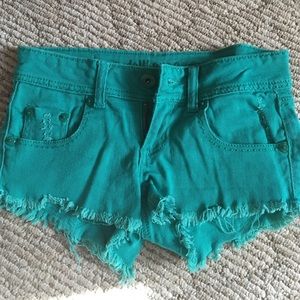 Teal distressed denim shorts