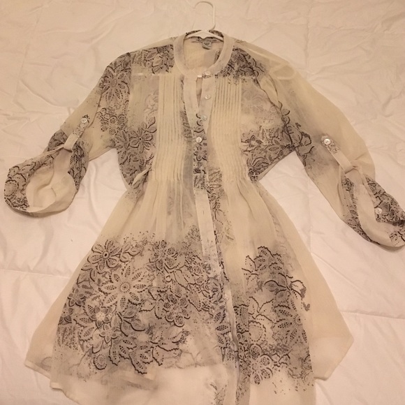 Sheer lace printed babydoll blouse with tieback.