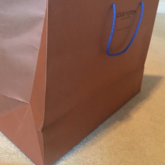 2 Louis Vuitton bags and one envelope
