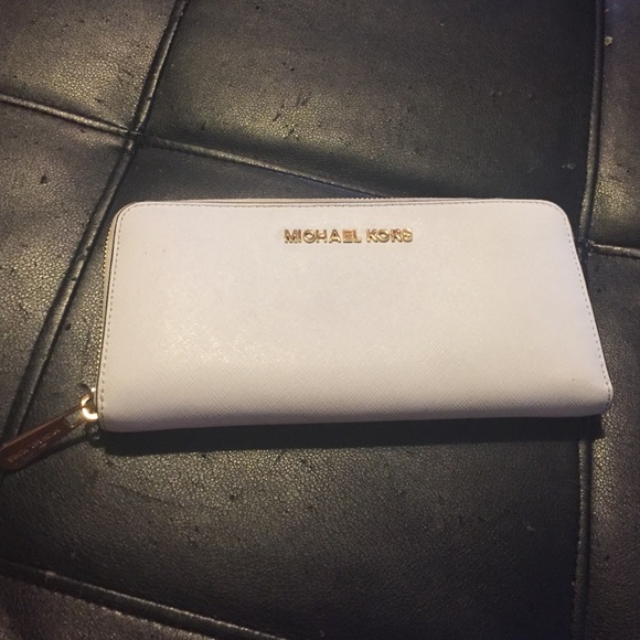 Michael Kors white wallet.