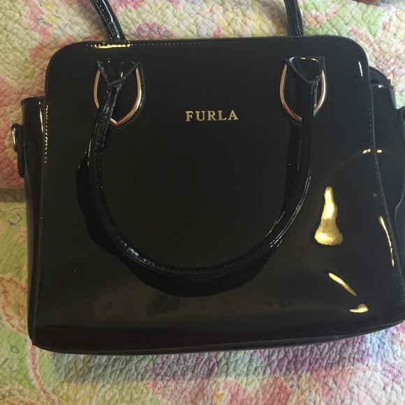Black patent leather Furla bag.