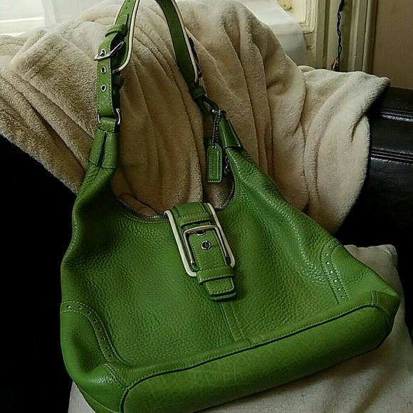 Pretty green Coach purse with white trim