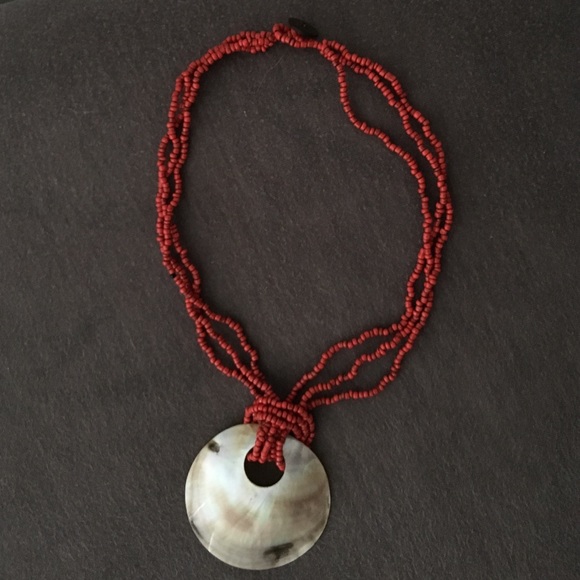 Red bead necklace with accent shell