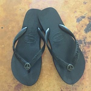 Havaianas flip flops with crystal peace sign.