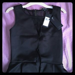 A sexy black peplum dress by Guess.